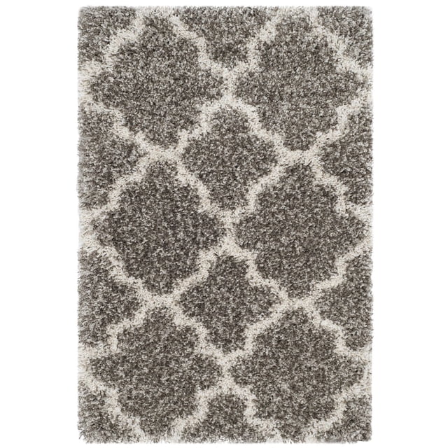 Safavieh Hudson Jaye Geometric Shag Area Rug with a thick, plush shag pile in gray and ivory featuring classic tile-shaped geometric patterns, ideal for adding texture and durability to urban or modern décor in high-traffic areas.