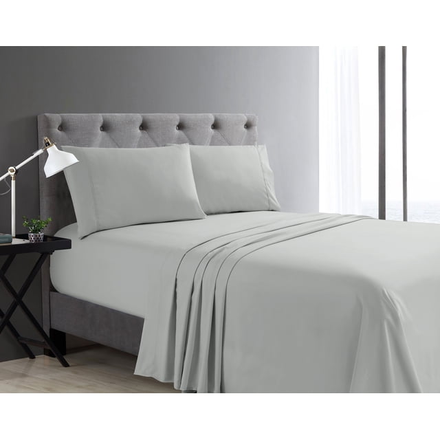 Swift Home Basic 3-Piece Twin Size Sheet Set in light gray on a bed with a tufted gray upholstered headboard, including fitted sheet, flat sheet, and pillowcases made of ultra-soft, breathable, wrinkle-resistant fabric with deep pockets fitting mattresses up to 16 inches, shown in a modern bedroom with a side table, lamp, and sheer curtain window, ideal for easy care and everyday comfort.