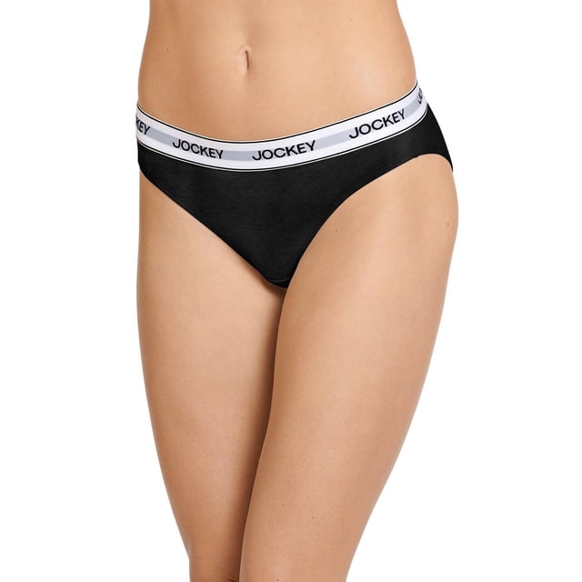 Women's Cotton Stretch Bikini in black with a wide white elastic waistband featuring the Jockey logo, front-facing on a model, mid-rise with higher-cut leg openings for a flattering longer leg look, made of breathable 95% cotton and 5% spandex for all-day comfort and stretch.