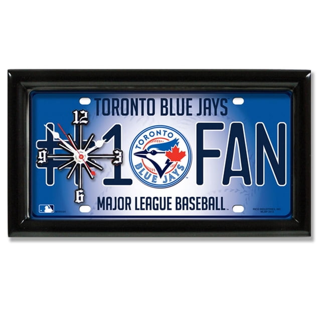 GTEI MLB Toronto Blue Jays Wall Clock with a black satin-finished 1-inch frame featuring a rectangular metal license plate design. The clock displays '#1 FAN' text and the Toronto Blue Jays logo on a blue background with quartz movement and black and red hands. Measures 7 by 13 inches, ideal for fan rooms or offices.