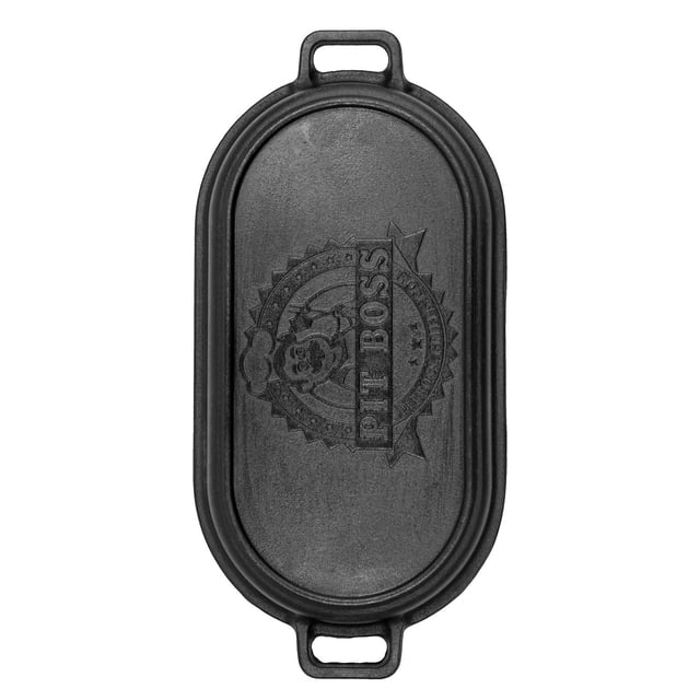 Pit Boss 6 Quart Cast Iron Roaster Pan with Griddle Lid shown from above, featuring an oval cast iron lid embossed with the Pit Boss logo and equipped with handles on both ends. The pre-seasoned lid doubles as a griddle, suitable for roasting, baking, and grilling with even heat distribution on ovens, grills, or campfires.