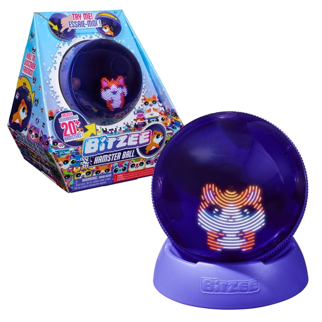 Bitzee Hamster Ball Interactive Digital Pet in a translucent purple sphere on a purple base, displaying a pixelated LED hamster character in orange, white, and blue. The packaging shows pixel art and promotes over 20 collectible hamsters with interactive features, ideal for kids who enjoy electronic pet toys.