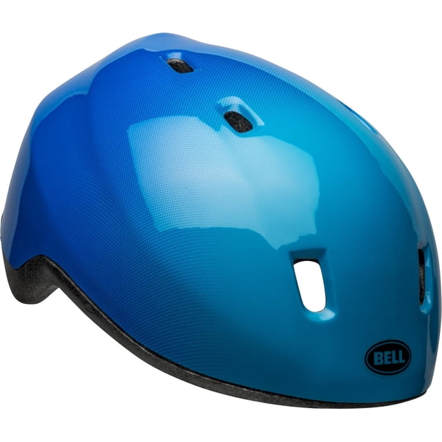 Bell Sports Patch Toddler Bike Helmet in glossy blue with a rounded shape and seven ventilation slots, featuring the Bell logo on the front. Designed for 48-52 cm head sizes, it includes Bell True Fit™ and PinchGuard™ systems for secure, comfortable protection.