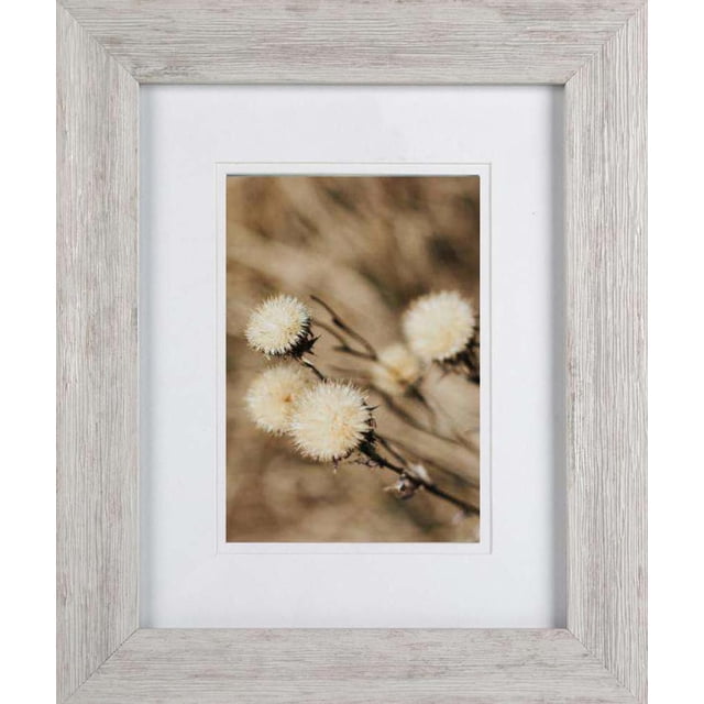 Hometrends Plaxis Photo Frame with a pink pearl finish and rustic wood texture, decorative table picture frame with white double mats, holding an 8x10 inch photo of soft white fluffy seed heads on brown stems, ideal for traditional and cottage décor.