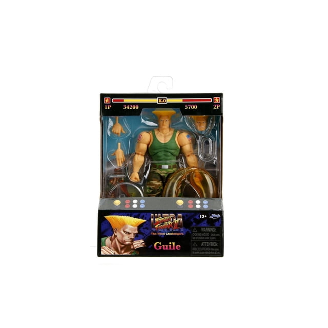 Jada Toys STREET FIGHTER II ACTION FIGURE - Guile, a 6-inch collectible figure in green tank top and camouflage pants, displayed in arcade-style packaging with interchangeable hands and accessories, designed to reflect the classic video game character.