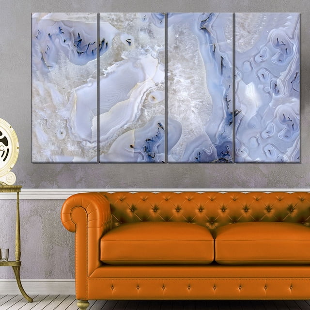 Design Art Agate Stone Background Abstract Canvas Wall Art Print featuring a four-panel gallery wrapped canvas with blue and white agate stone patterns, ready to hang above an orange tufted leather sofa in a modern home décor setting, often used to add a natural stone aesthetic to living or office spaces.