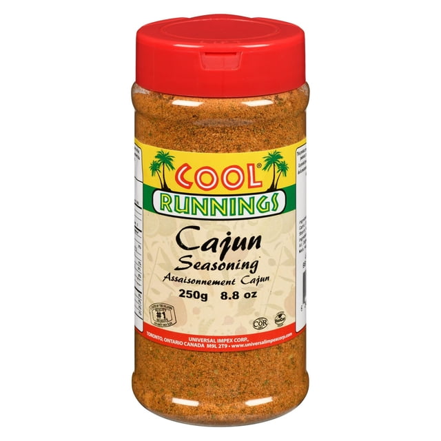 Cool Runnings Cajun Seasoning 250g bottle with a red flip-top lid filled with a coarse orange-brown spice blend. The label features the brand name with palm trees and authentic Caribbean-inspired Cajun spices, ideal for grilling meats, fish, and vegetables.