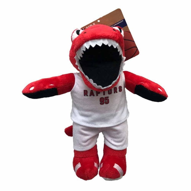 Silver Paw NBA Toronto Raptors Mascot 9 inch dog toy with squeaker, a red plush dinosaur wearing a white Raptors basketball jersey numbered 95 and white shorts, designed to keep dogs engaged while showing support for the Toronto Raptors team spirit.