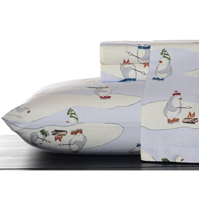 Eddie Bauer Skating Penguins Flannel Sheet Set King Blue featuring a playful design of penguins skating and roasting marshmallows on a sky blue background. Made from 100% percale cotton with a 200 thread count, this set includes a flat sheet, a fitted sheet with deep pockets for mattresses up to 18 inches, and two king pillowcases. The flannel material is brushed three times for added softness and warmth, making it ideal for layering during colder months. Certified Standard 100 by Oeko-Tex for safety and quality.
