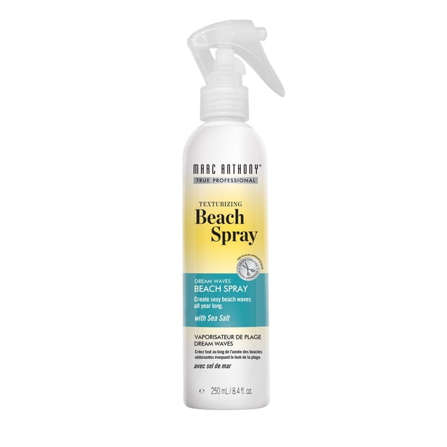 Marc Anthony Texturizing Dream Waves Beach Spray with Sea Salt in a 250 mL white plastic spray bottle with yellow and teal label, designed to create soft, tousled beach waves and add texture to hair all year long, often used to enhance natural waves or add volume to fine hair.