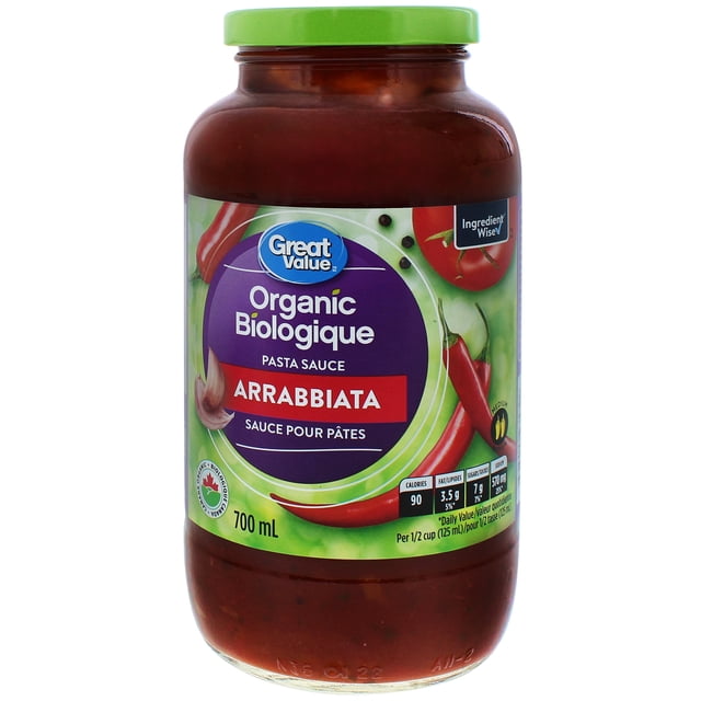 Great Value Sauce pour Pâtes Arrabbiata Biologique dans un Pot en Verre de 700 ml avec Couvercle Vert, Présentant une Étiquette avec des Graphiques de Piments chili Rouges, d'Ail et de Tomate, Certifiée Biologique et Marquée « Wise » comme Ingrédient, Offrant une Chaleur Moyenne et une Riche Saveur de Tomate, Convient aux spaghetti, Lasagnes et Boulettes de Viande.