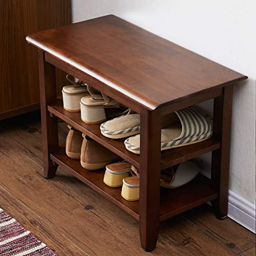 ACRO Storage Bench Wooden Shoe Bench in rustic brown, measuring 23.6 inches in length, 11.8 inches in width, and 16.5 inches in height. Made of 100% rubberwood, this durable and eco-friendly bench features a solid wood top and two slatted shelves for shoe storage. The bench is shown in an entryway setting with various shoes neatly placed on the shelves, highlighting its functionality and load capacity of 550 lbs.
