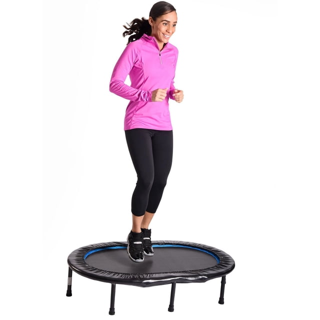 Stamina Oval Fitness Trampoline centered front-facing view showing oval rebounding surface with optic blue border and black safety pad covering elastic bands; compact 45" by 33" (114 cm by 84 cm) footprint, 250 lb capacity, suited for home rebounding and balance drills.