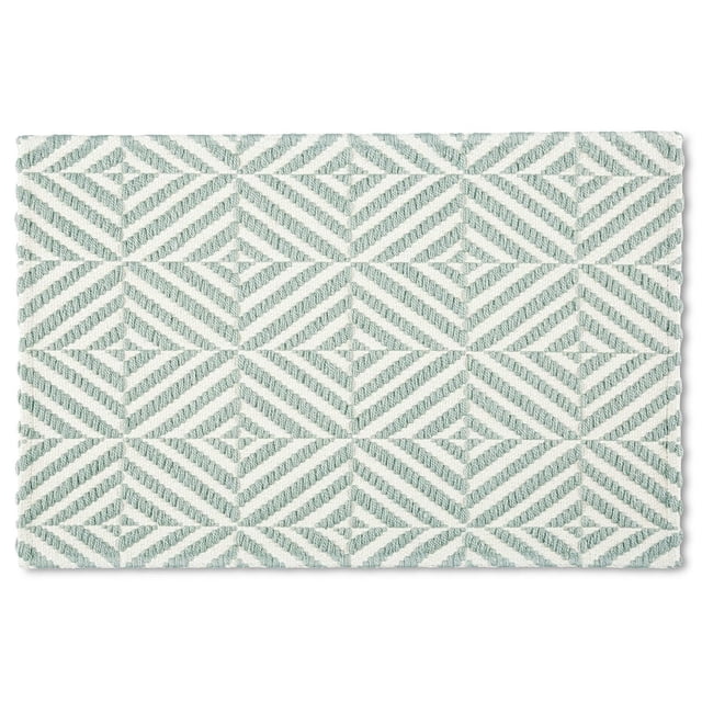 Mainstays Montana Kitchen Mat, 18"W x 27"L, featuring a textured woven geometric diamond pattern in soft green and white. This rectangular mat provides ergonomic support with non-slip backing and is easy to clean, suitable for kitchen or standing areas.
