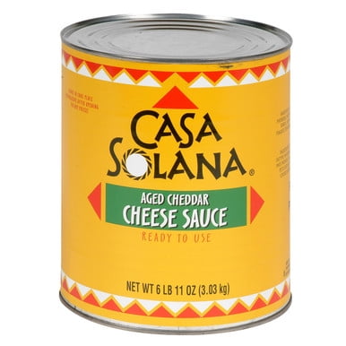 Casa Solana Sauce Fromage Cheddar Vieilli 2,84 L/100 oz Boîte avec une Étiquette Jaune Comprenant des accents Rouges et Verts. l'Étiquette Affiche le Nom de la Marque de Façon Bien en Vedette avec le Texte « Sauce Cheddar Vieilli » et « Prêt à Utiliser ». le Poids net Est de 6 lb 11 oz (3,03 kg).