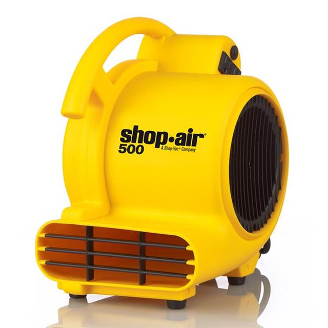 Shop-vac 1032005 120V AC 500-Maximum CFM Air Mover in bright yellow housing with a compact design. Ideal for outdoor power equipment tasks, it features three airflow positions for drying carpets, floors, walls, and ceilings, onboard outlets for connecting multiple units, and a circuit breaker. Designed for horizontal and vertical airflow with a 12 ft power cord and 3-speed settings.