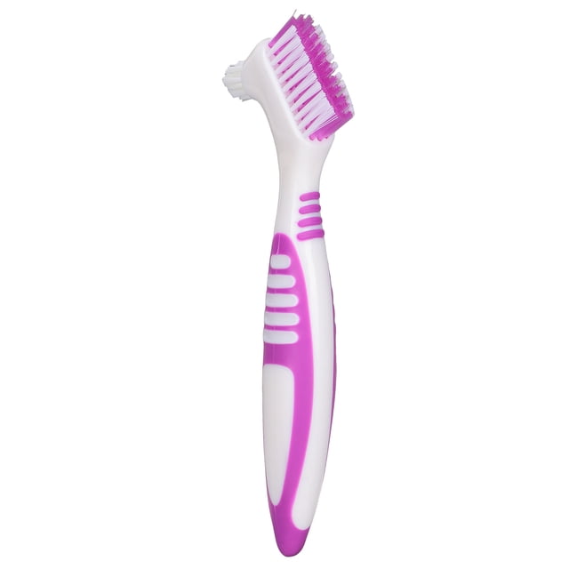 False Teeth Cleaning Brush, a dual-headed plastic denture brush designed for cleaning false teeth. The brush features a white and purple ergonomic handle with textured grips for comfortable use. One head has firm bristles for cleaning hard-to-reach surfaces, while the smaller head is ideal for precision cleaning. Suitable for partial, half, and complete dentures, it effectively removes dirt and residue, helping to prolong the life of dentures.