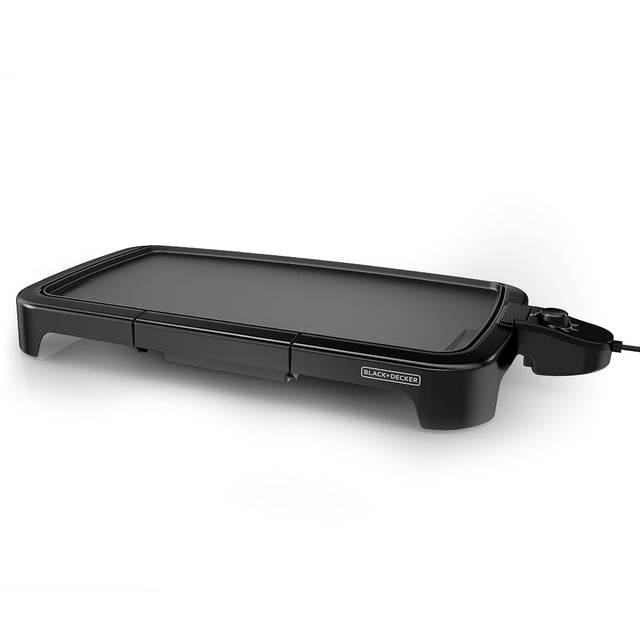 BLACK + DECKER Family-Sized Electric Griddle with Warming Tray, 20" x 11" large black non-stick surface with removable temperature control probe and adjustable knob on the right, slide-out drip tray below the front, and fully immersible base for easy cleaning, suitable for cooking breakfast and family meals.