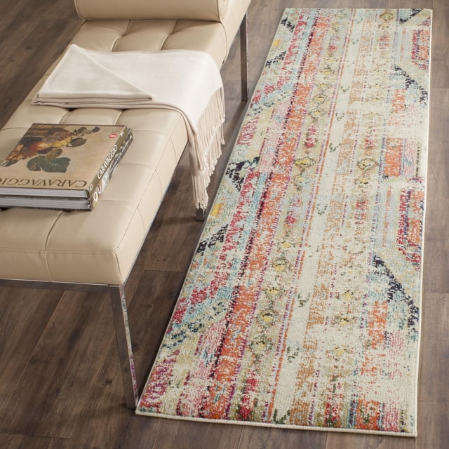 Safavieh Monaco Risto Tapis Coureur Abstrait en Polypropylène durable avec un Motif Abstrait Multicolore Vif en Rouge, orange, Jaune, Bleu et Crème sur un Plancher de Bois à Côté d'Un Banc en Cuir beige avec un Jeté Crème et un Livre, Idéal comme Tapis d'Accent pour Intérieurs de Maison.