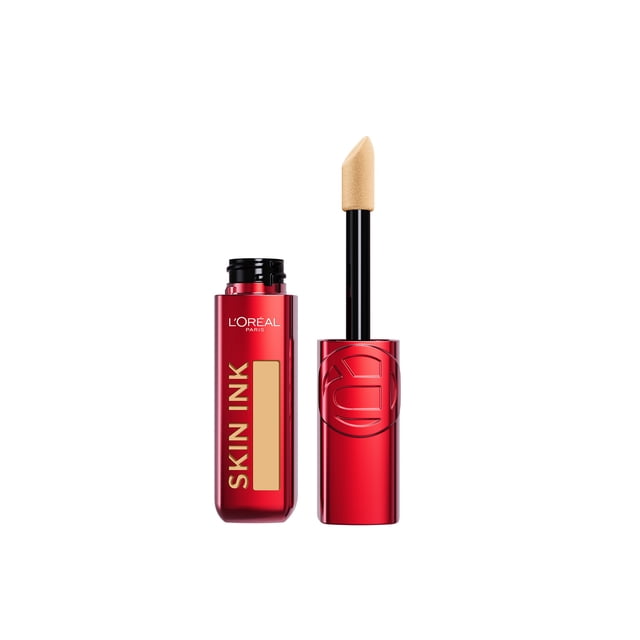 L'Oreal Paris Foundation & Concealer Hybrid Infallible Skin Ink in a glossy red rectangular bottle with gold lettering and a beige shade window, paired with a black applicator wand featuring an angled beige sponge tip, providing up to 48-hour transfer-resistant, waterproof, matte finish coverage ideal for even complexion and concealing imperfections.
