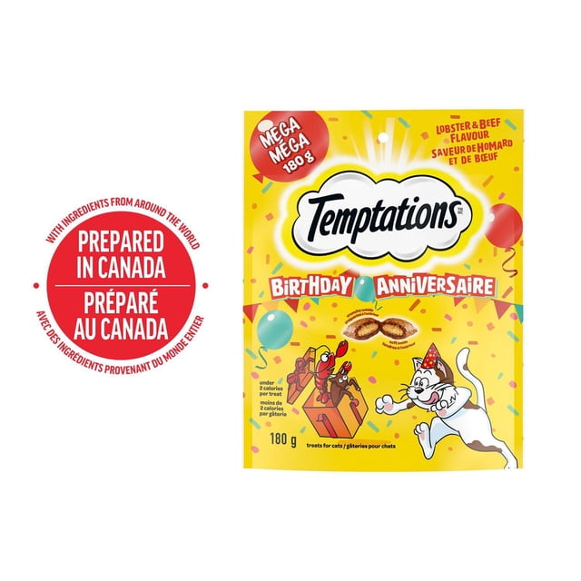 TEMPTATIONS BIRTHDAY Lobster & Beef Flavour Adult Cat Treats 180g resealable pouch with a yellow background, featuring a white cat wearing a party hat, colorful confetti, and cartoon lobsters with a gift box, highlighting crunchy outside and soft inside treats under 2 calories each, made in Canada, suitable for celebrating cats' birthdays or special occasions.