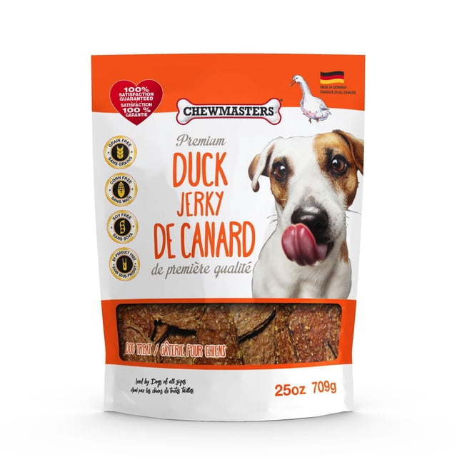 Chewmasters Duck Jerky Dog Treats in a 25oz (709g) orange and white resealable bag featuring a dog licking its nose, with visible duck jerky pieces through a clear window, labelled grain-free, corn-free, soy-free, made in Germany, suitable as a healthy training treat.