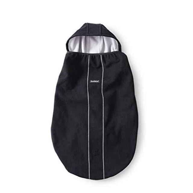 BabyBjorn Baby Carrier Cover in black, designed to fit over BabyBjorn front and hip carriers. Features a soft fabric with a hood and white interior lining, providing warmth and protection for babies during outdoor activities.