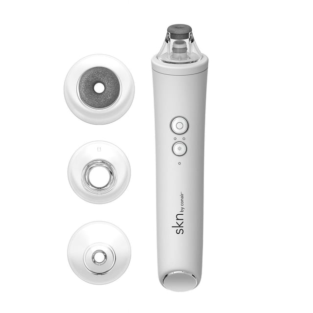 skn by Conair® Microdermabrasion Tool with a white USB rechargeable handle featuring two control buttons and four detachable clear treatment tips including two crystal diamond-head exfoliators, a small pore extractor, and a large pore extractor for customizable vacuum suction exfoliation and pore cleansing suitable for all skin types.