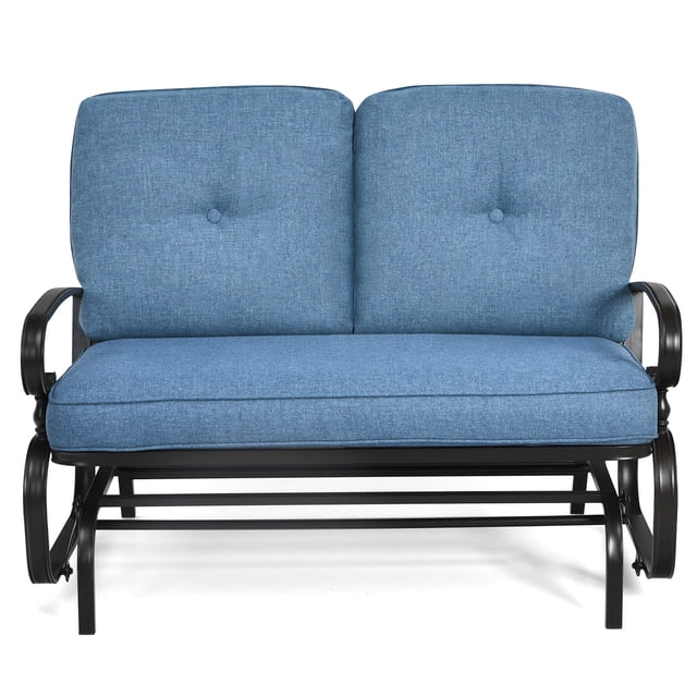Patiojoy 2-Person Outdoor Bench Patio Swing Glider Chair with Cushions Rocking Chair Cushioned Sofa Blue. This glider bench features a sturdy steel frame with a smooth gliding mechanism supported by two glide arms. The seat and back cushions are upholstered in blue olefin fabric, offering a soft and durable surface. The bench includes curved armrests for added comfort and four non-slip foot pads for stability. Designed to hold up to 440 lbs, it accommodates two people and is suitable for patios, gardens, or indoor spaces.