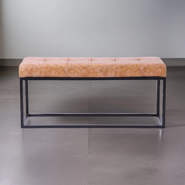 Heavenly Collection Tan Distressed Leather Bench with rustic farmhouse style, featuring a tufted tan distressed leather seat on a sleek black stainless steel base with polished finish, measuring 17 inches high, 39 inches wide, and 12 inches deep, ideal for entryway or bedroom seating and often used as a stylish storage bench alternative.