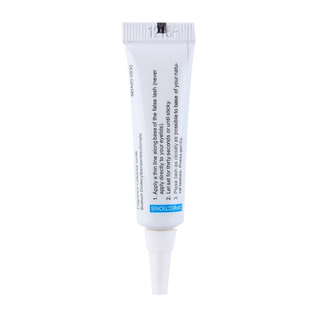 False Eyelashes Glue Strip Eye Lash Adhesives Waterproof Strong Clear Black by Estink. A white tube with a precision nozzle and printed instructions for applying adhesive to false eyelashes. Ideal for beauty enthusiasts seeking secure, waterproof lash application.