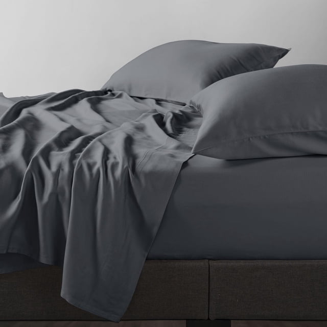 Allswell 300 Thread Count Soft & Silky 4-Piece Viscose from Bamboo Sateen Sheet Set in blue-gray, showing a close-up of a bed with fitted sheet, flat sheet, and two pillowcases in breathable, moisture-wicking bamboo fabric with a sateen weave, draped over a dark upholstered bed frame, suitable for all seasons.