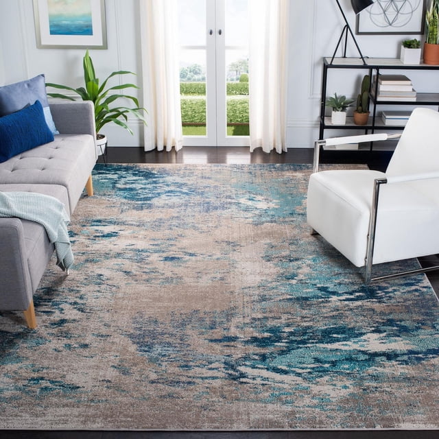 SAFAVIEH Madison Oscar Abstract Distressed Area Rug featuring a blue and beige abstract distressed pattern, power-loomed polypropylene blend, placed on dark hardwood floors in a contemporary living room between a grey sofa with blue cushions and a white armchair, near white curtains and a black metal shelf with plants and books, ideal for enhancing transitional home decor.