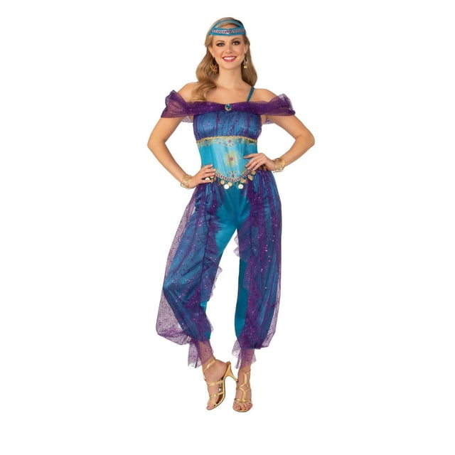 Jeweled Genie Women's Costume with a blue polyester jumpsuit featuring sheer purple shimmering layers over the bust and legs, gold printed accents, hanging coins at the waist, and a coordinating jeweled headpiece, paired with gold strappy sandals and bracelets.