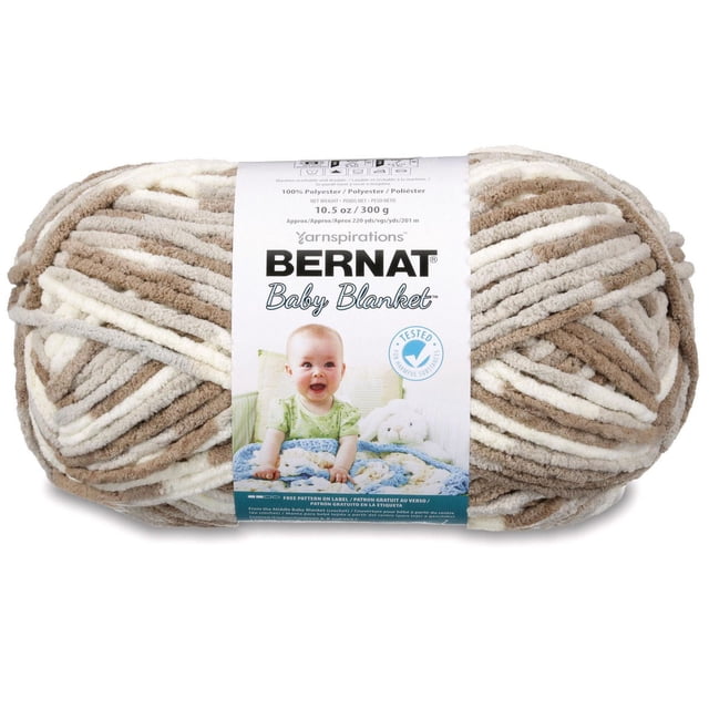 Bernat Fil pour Couverture pour Bébé en chenille de polyester beige et Crème, super Volumineux #6, 10,5 oz (300 g), 220 Verges, Présenté comme un Écheveau avec une Étiquette Mettant en Vedette un Bébé et une Couverture Tricotée Bleue, Convient aux Projets de Tricot Rapide de Couverture pour Bébé.