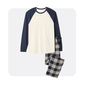 A set of pajamas consisting of a long-sleeve, cream-colored shirt with navy blue sleeves and collar, paired with navy blue, cream, and yellow plaid pants. The pajamas are neatly arranged on a light gray background.