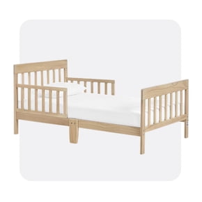 Light wood toddler bed with slatted headboard, footboard, and side rails, shown with white bedding and pillow.