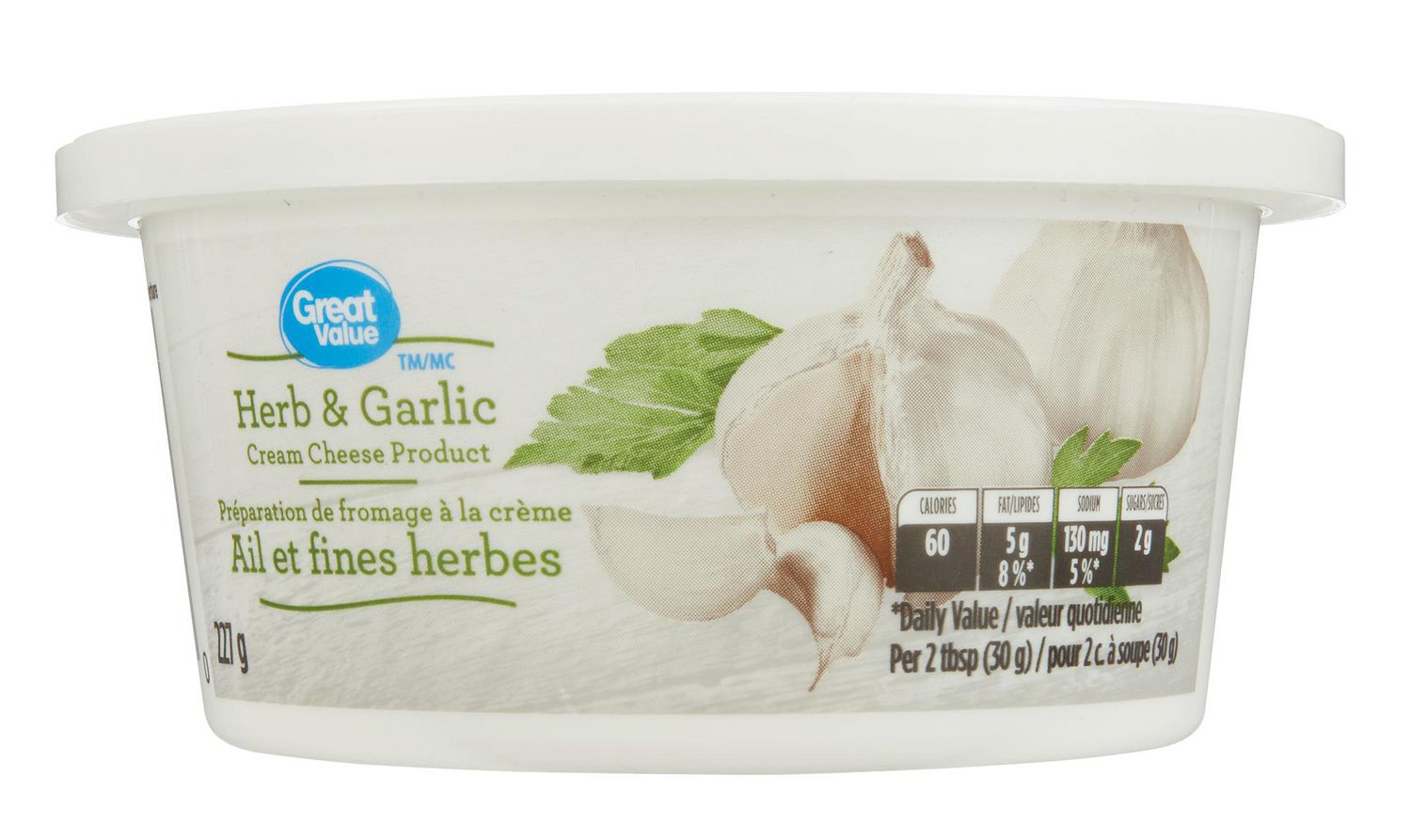 Great Value Cream Cheese Spread Herb & Garlic off-white spread with visible flecks of green herbs and garlic pieces in a smooth, spreadable cream cheese; pictured on a bagel and a cracker, suitable for spreading, dipping, or using as a savoury recipe ingredient.