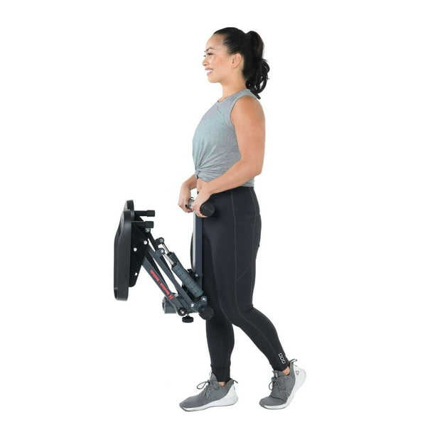 Woman Doing Jambes Exercice Sur Machine Steppers D'escalier, Dans Une Salle  De Sport