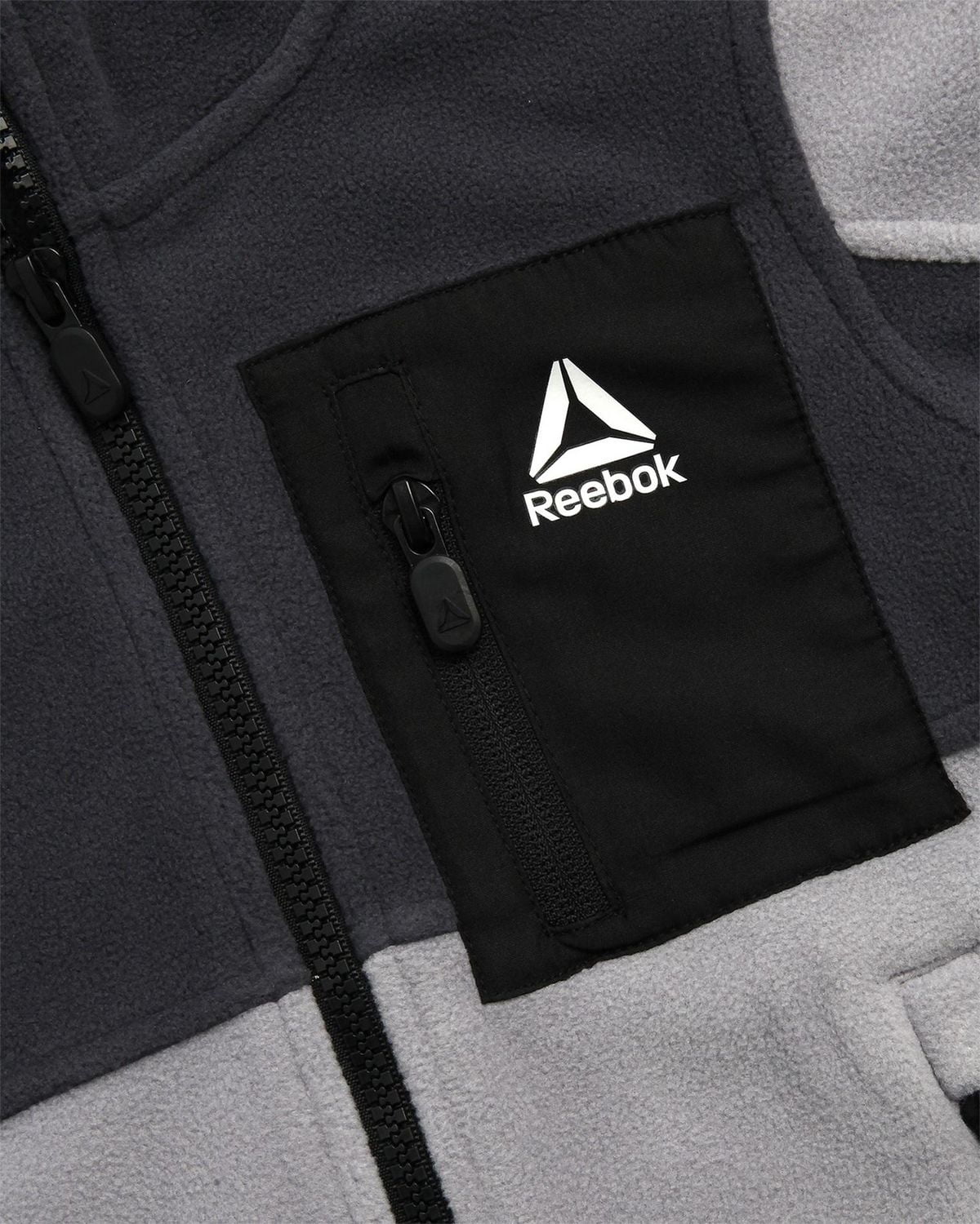 Veste légère en molleton Reebok avec poche poitrine zippée Veste légère en polar Reebok