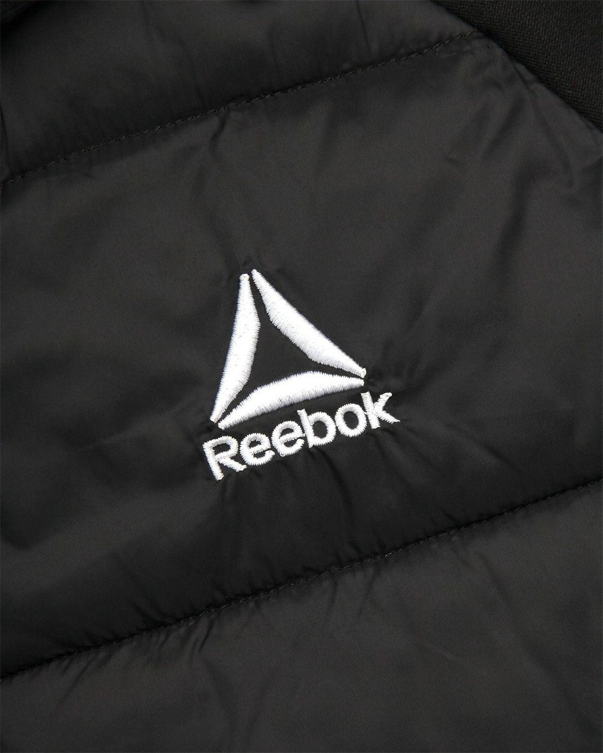 Reebok Women's Stretch Knit & Quilted Insulated Woven Jacket