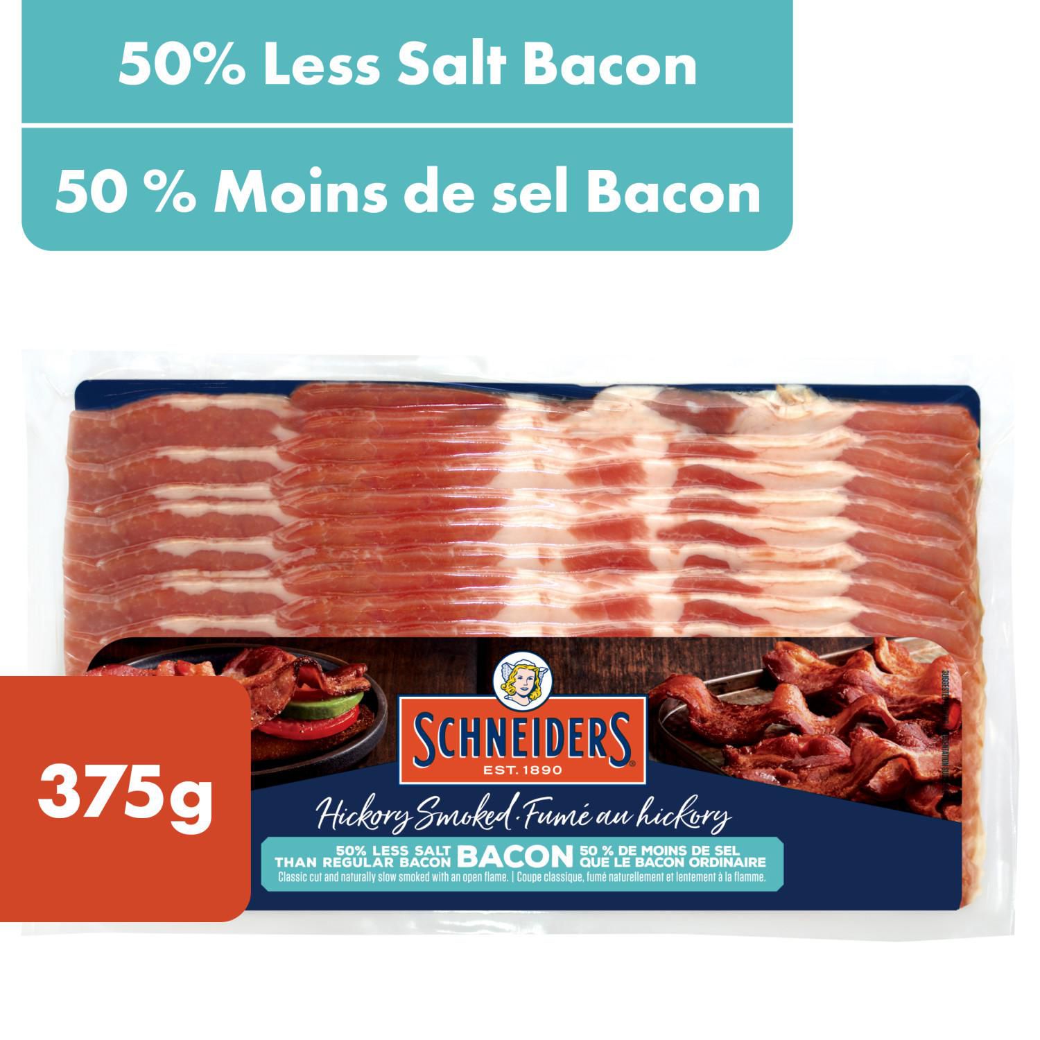 Schneiders Hickory Smoked 50% Less Salt Bacon, 375 g — packaged classic-cut bacon slices of Schneiders low-sodium hickory smoked pork, slow smoked for smoky flavour; ideal for breakfast, sandwiches and salads and often used as a crumbled topping for baked potatoes.