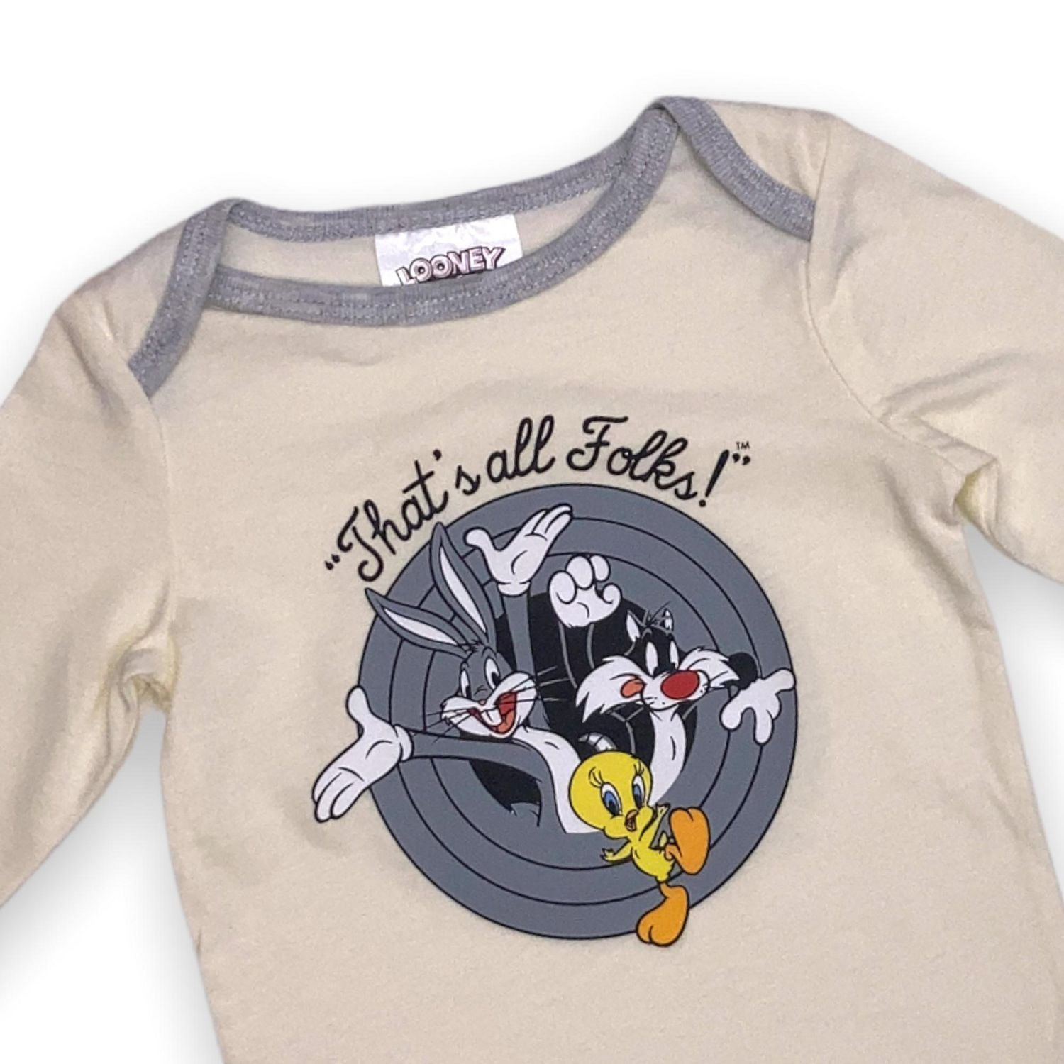 Looney Toons Barboteuse bébé. Cette barboteuse pour bébé à manches longues et col rond est doté de 3 boutons-pression à l'entrejambe pour un retrait facile et