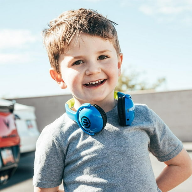 Cool boy with headphones listening music, colorful paints smudges