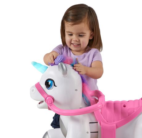 toddler riding unicorn