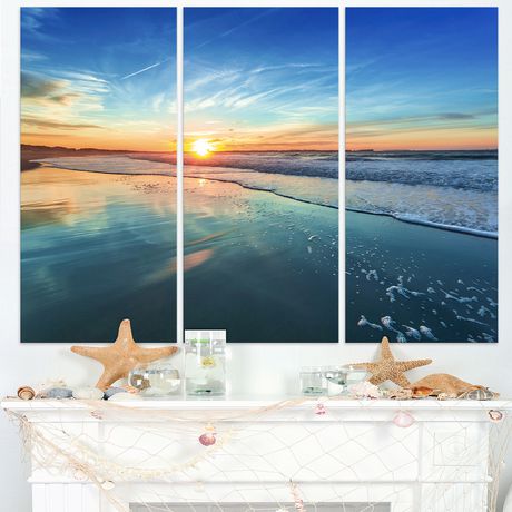 Design Art Blue Seashore with Distant Sunset Seashore Canvas Wall Art ...